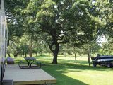 Seasonal campsite with deck at Oak Park Kampground
