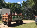 Camping guests inside a hay wagon at Oak Park Kampground